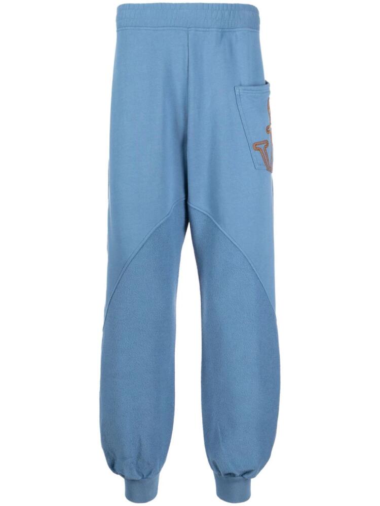 JW Anderson panelled organic cotton track pants - Blue Cover