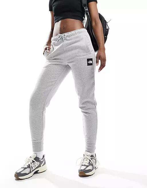 The North Face NSE Box track pants in gray Cover