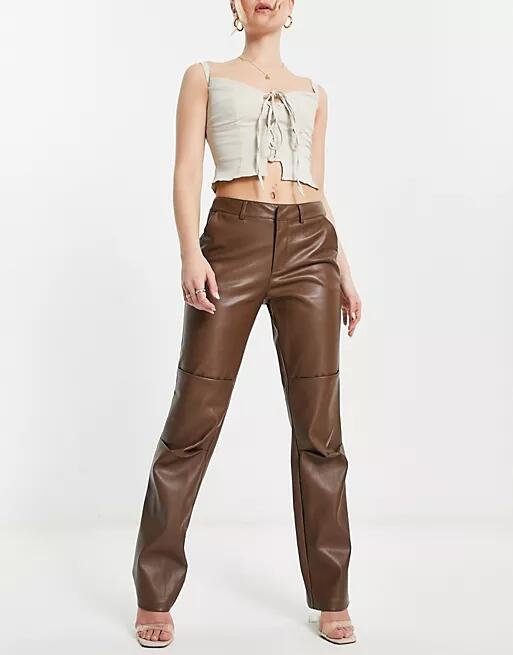 NA-KD faux leather low rise pants in brown Cover