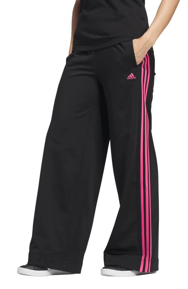 adidas Essentials Recycled Polyester Tricot Wide Leg Track Pants in Black/Pulse Magenta Cover