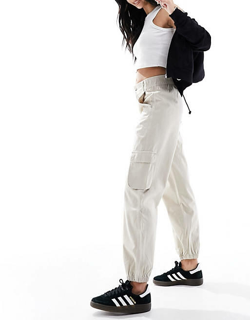 Bershka cuffed cargo pants in sand-Neutral Cover