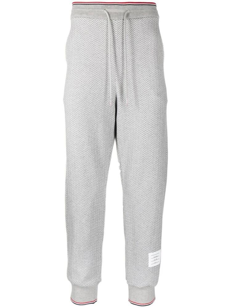 Thom Browne herringbone-pattern logo-patch track pants - Grey Cover