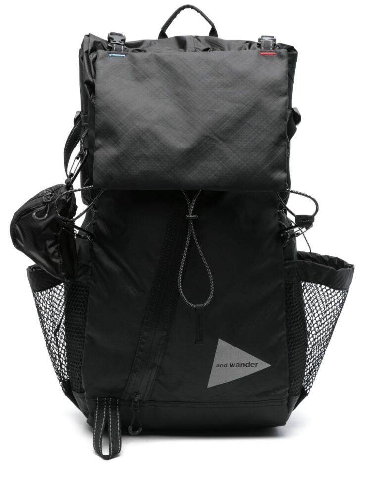 and Wander logo-print backpack - Black Cover