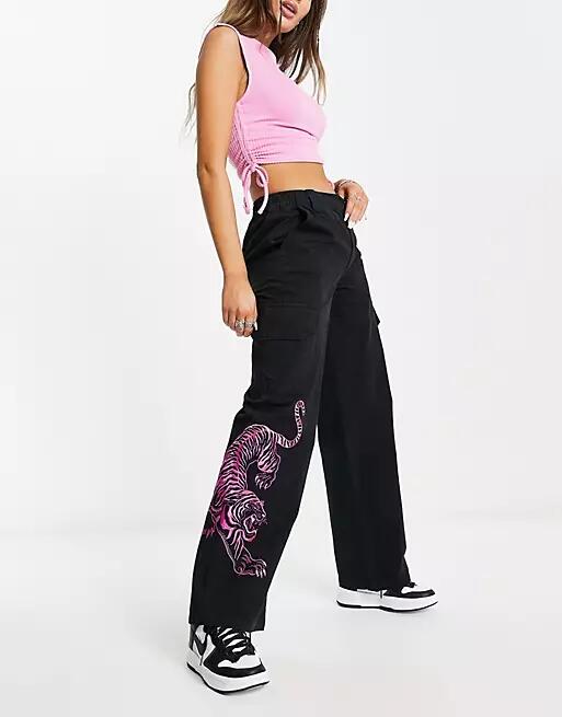 ASOS DESIGN cargo pants in black with tiger embroidery Cover