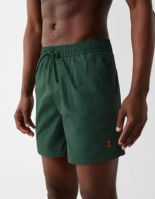 Bershka crinkle swim shorts in green Cover