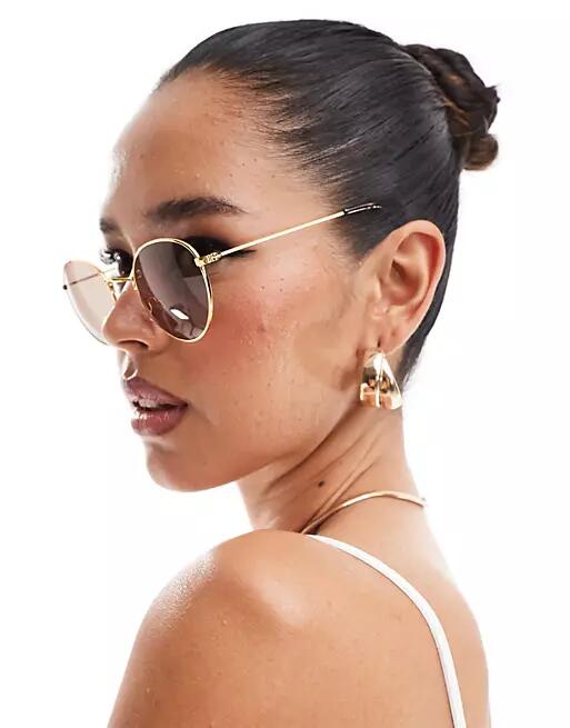 ASOS DESIGN metal round sunglasses in gold Cover