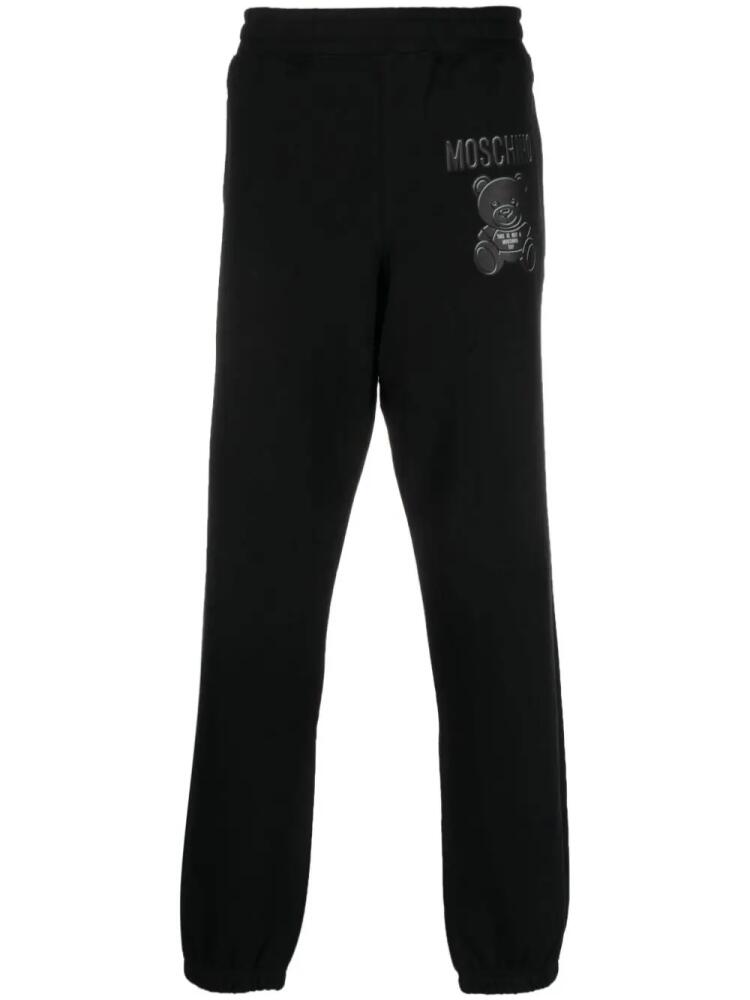 Moschino logo-print organic cotton track pants - Black Cover