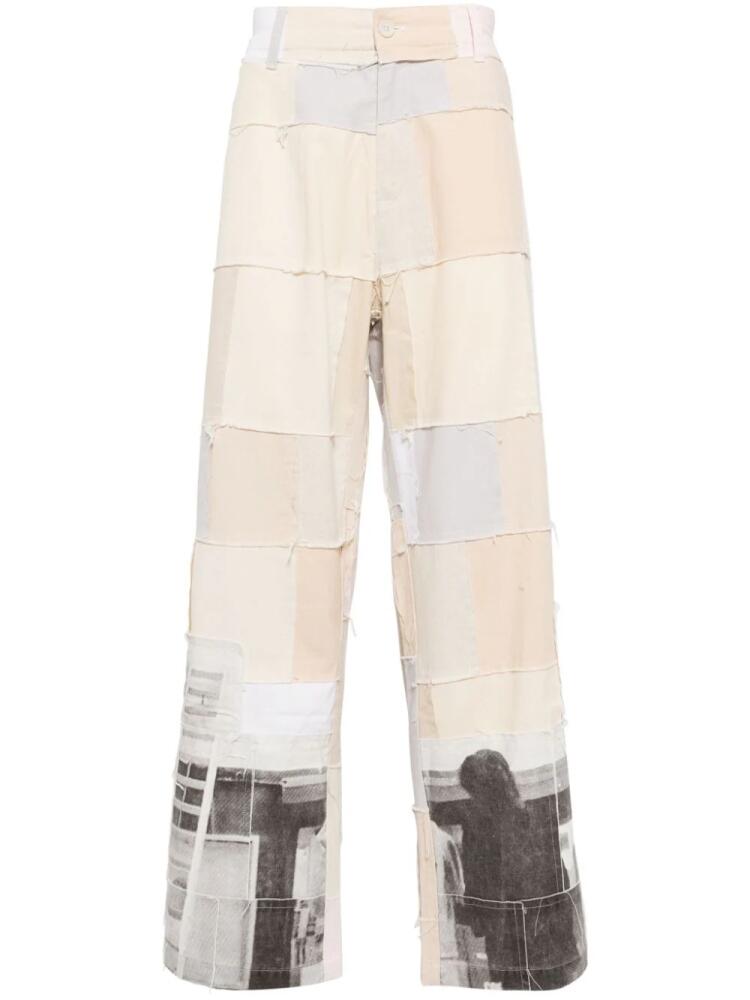 KidSuper graphic-print panelled design trousers - Neutrals Cover