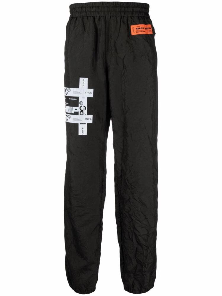 Heron Preston logo-patch track pants - Black Cover