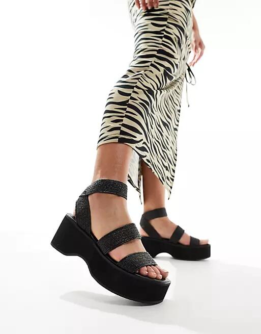 ASOS DESIGN Tangle elastic chunky wedges in black Cover