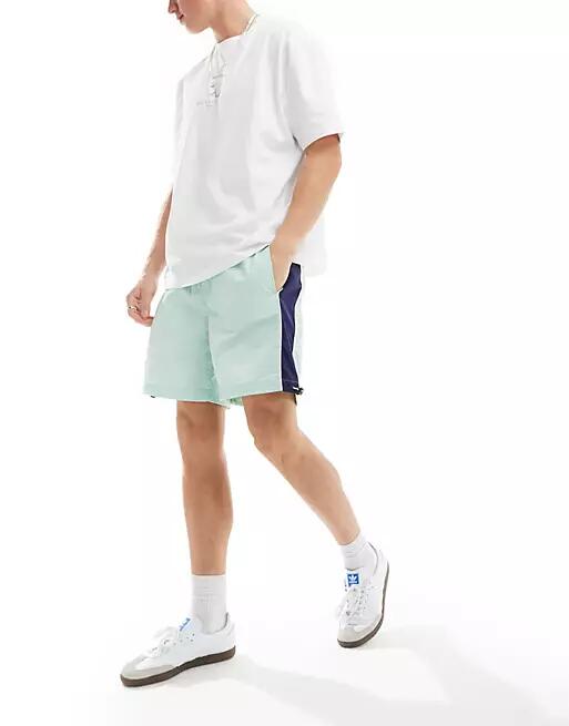 ASOS DESIGN nylon shorts in mint and navy side panels-Blue Cover