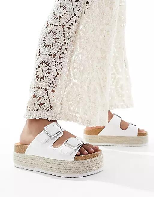 ASOS DESIGN Traffic double buckle flatform mules in white Cover