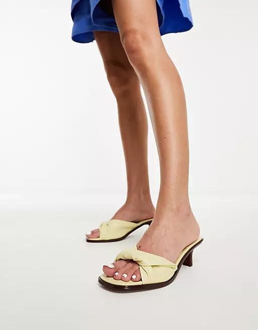 ASOS DESIGN Hither twist detail mid heeled mules in lemon-Yellow Cover