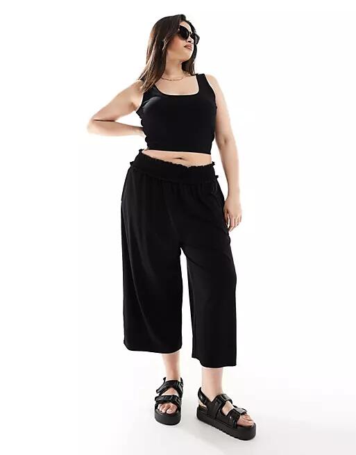 ASOS DESIGN Curve shirred waist cropped culotte pants in black Cover