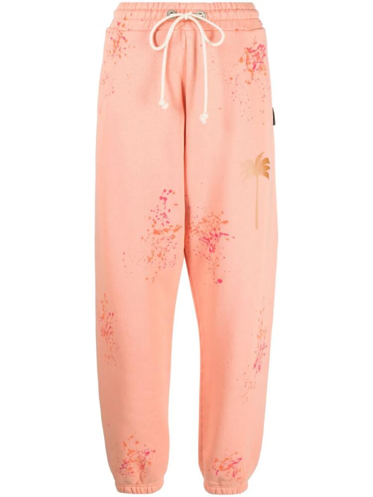 Palm Angels PXP paint-splatter track pants - Orange Cover