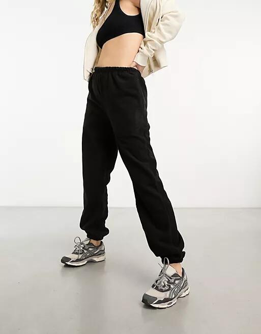 The Couture Club teddy fleece sweatpants in black Cover