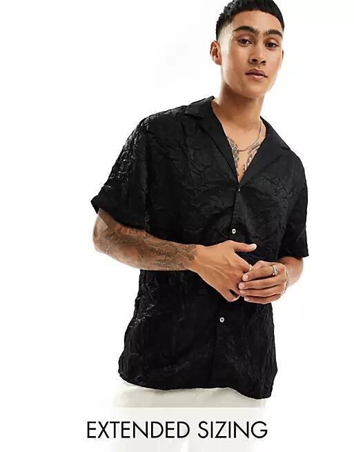 ASOS DESIGN short sleeve relaxed deep revere collar satin shirt in black Cover