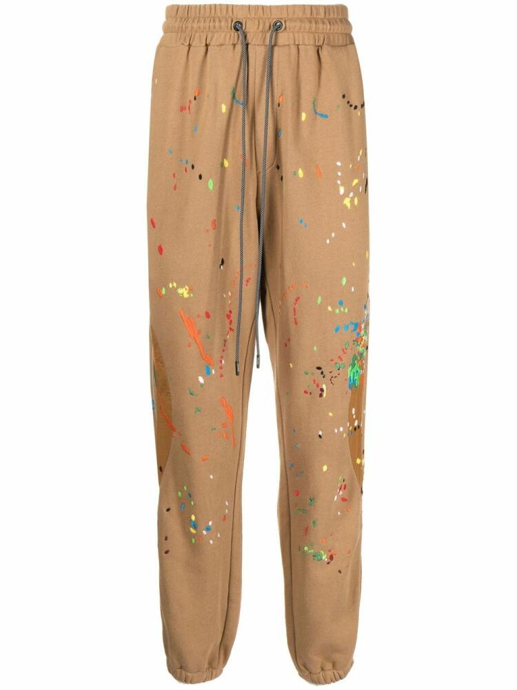 Mostly Heard Rarely Seen Warped paint-embroidered track pants - Brown Cover