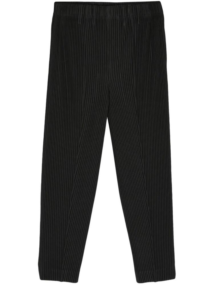 Homme Plissé Issey Miyake plissé cropped trousers - Black Cover