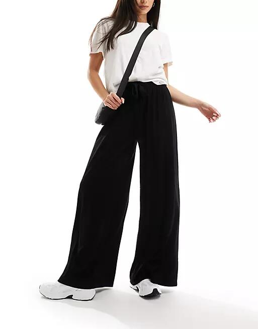 ASOS DESIGN tie belt wide leg pants in black Cover