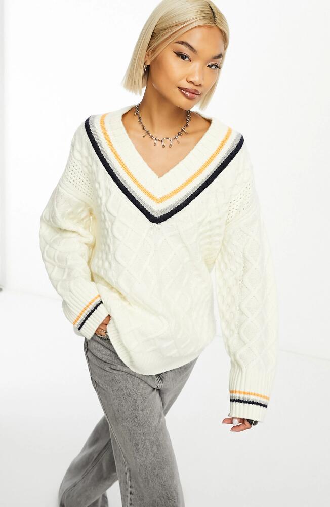 ASOS DESIGN V-Neck Cable Knit Varsity Sweater in Cream Cover