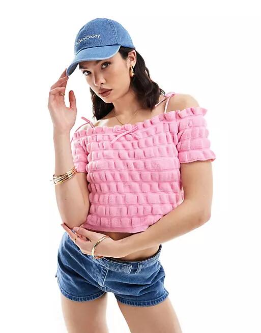 ASOS DESIGN knitted shirred bardot top with tie strap and bow detail in pink Cover