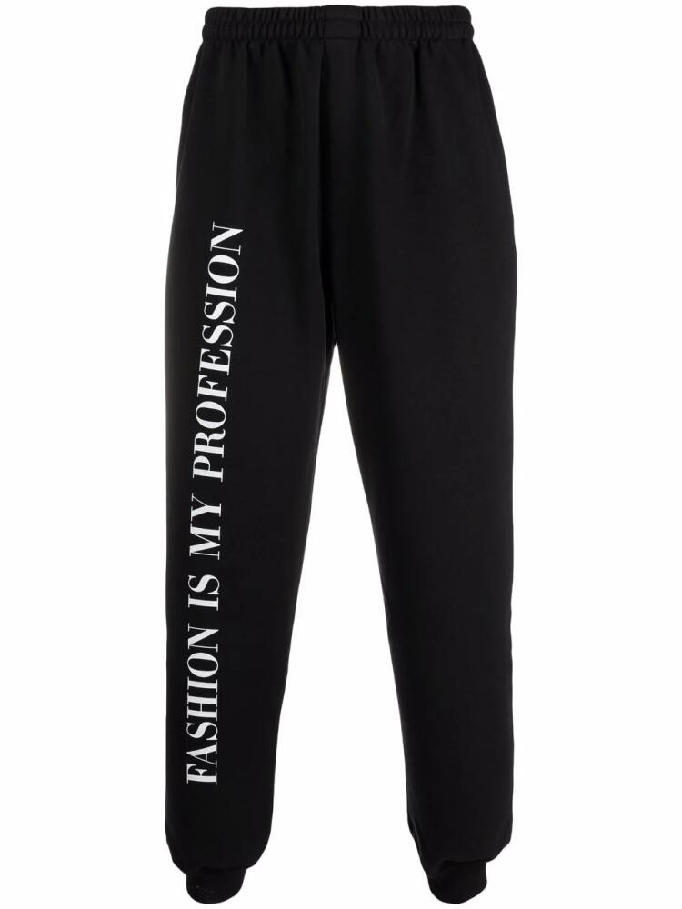 VETEMENTS slogan-print track pants - Black Cover