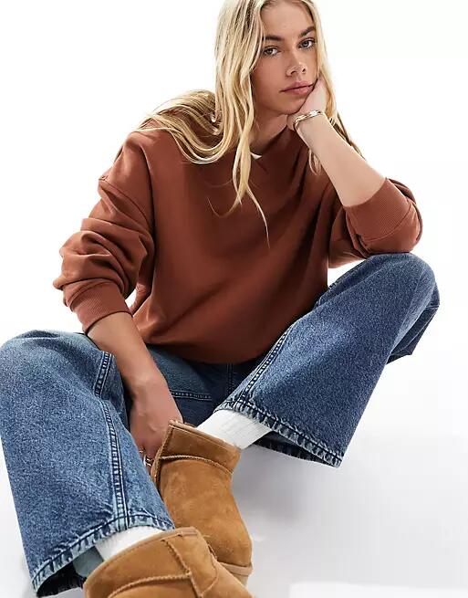 ASOS DESIGN v neck oversized sweatshirt in brown Cover