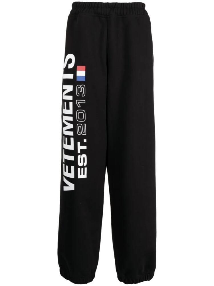 VETEMENTS Flag-logo print track pants - Black Cover