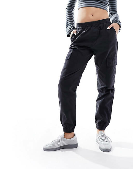 ASOS DESIGN cargo pants with cuffed hem in washed black Cover