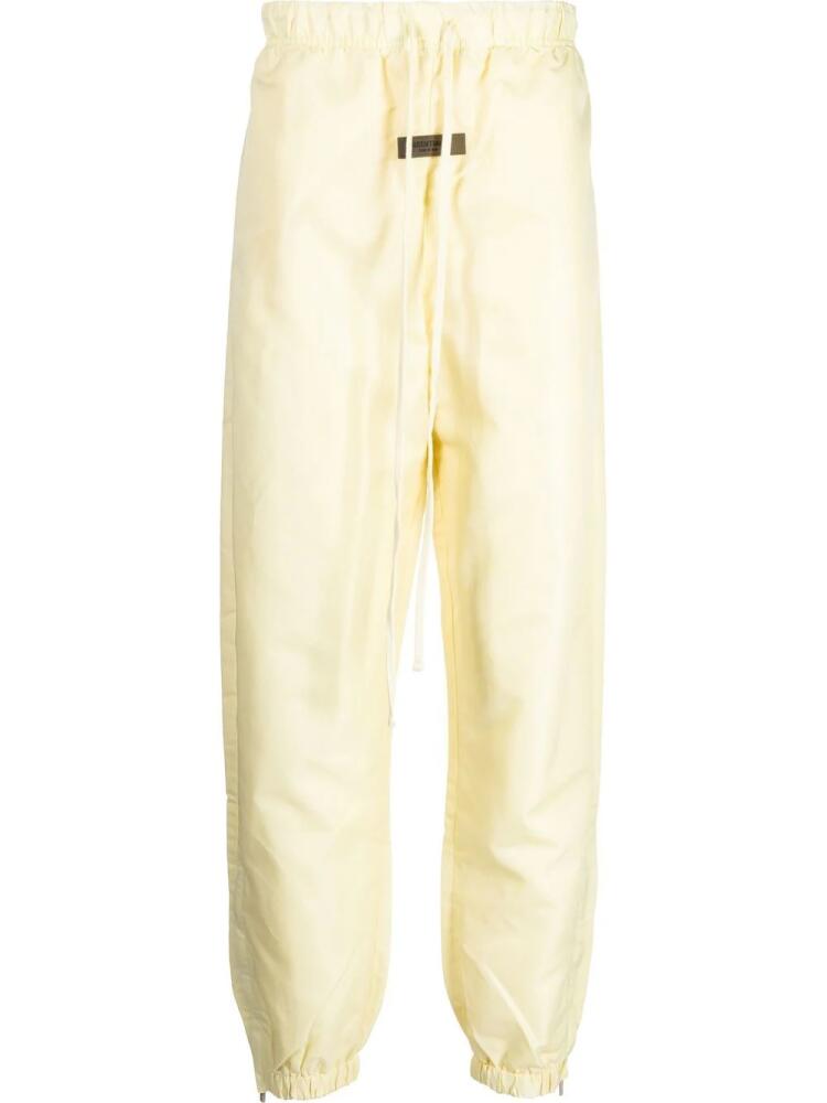 FEAR OF GOD ESSENTIALS logo-patch track pants - Yellow Cover