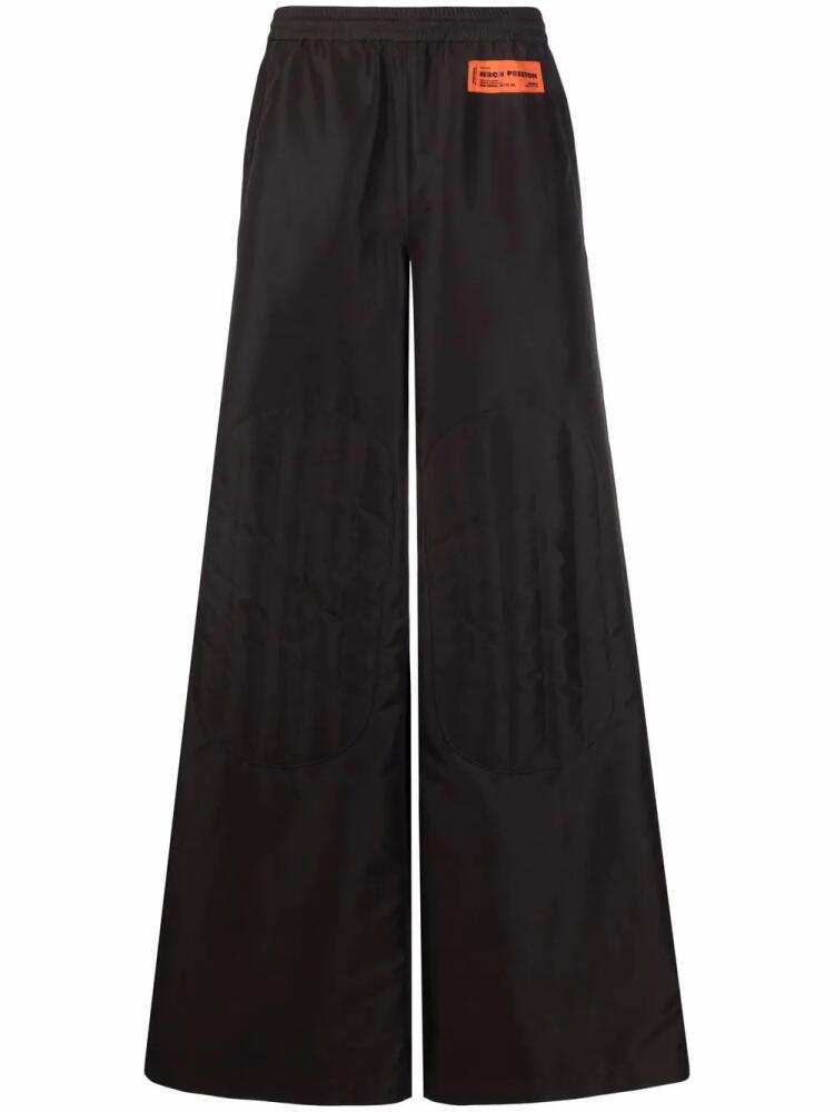 Heron Preston logo-patch wide-leg trousers - Black Cover