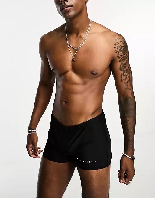 COLLUSION swim briefs in black Cover