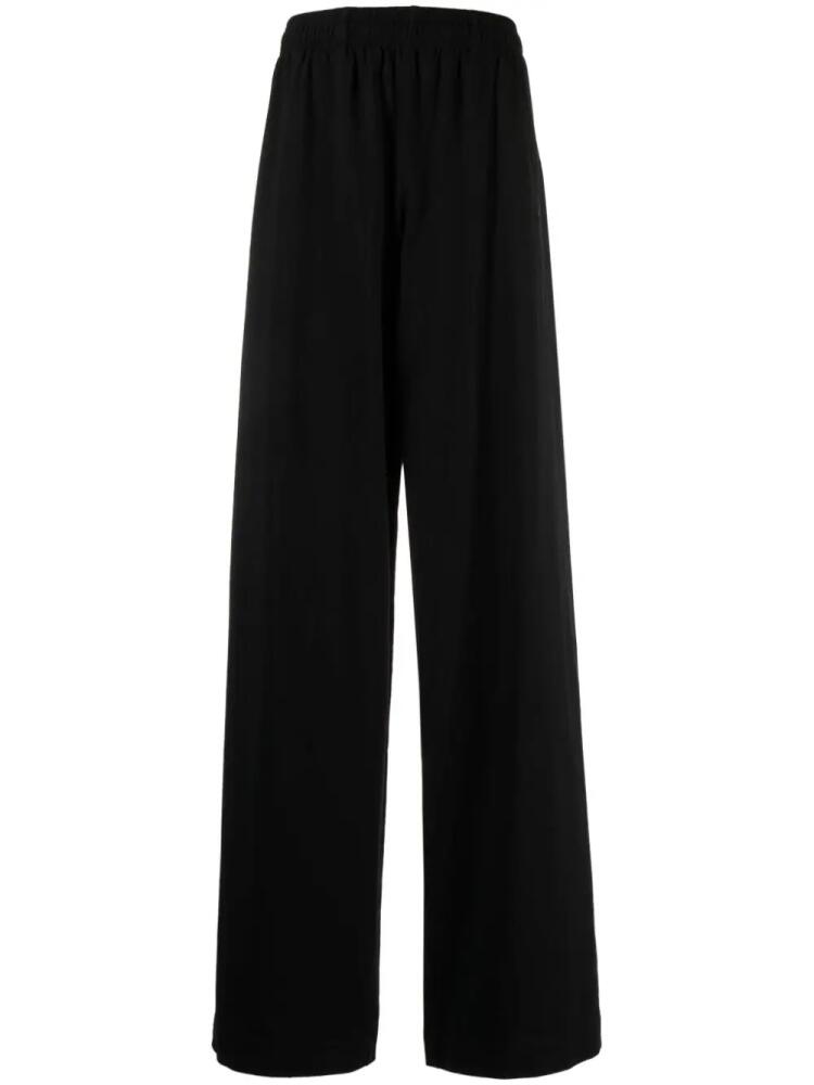 VETEMENTS logo-print track pants - Black Cover