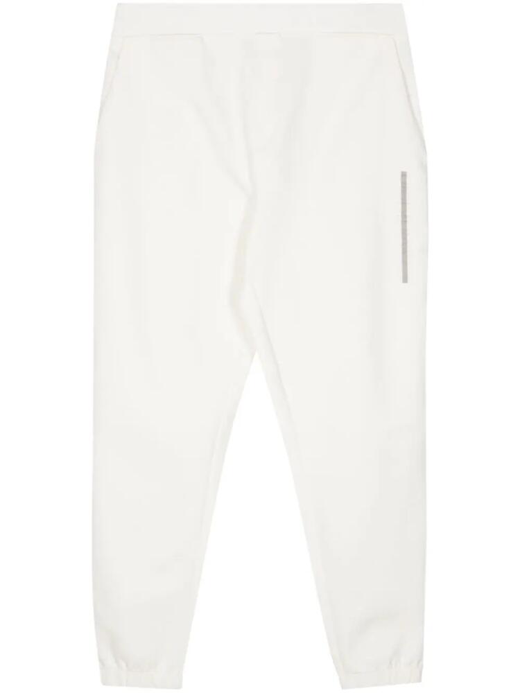 Calvin Klein logo-embossed track pants - Neutrals Cover