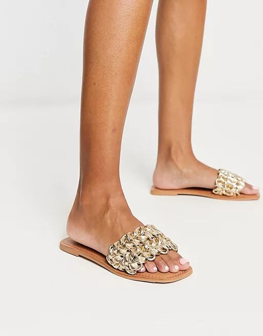 ASOS DESIGN Flora woven flat sandals in gold Cover