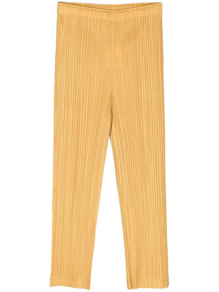 Pleats Please Issey Miyake plissé cropped trousers - Yellow Cover