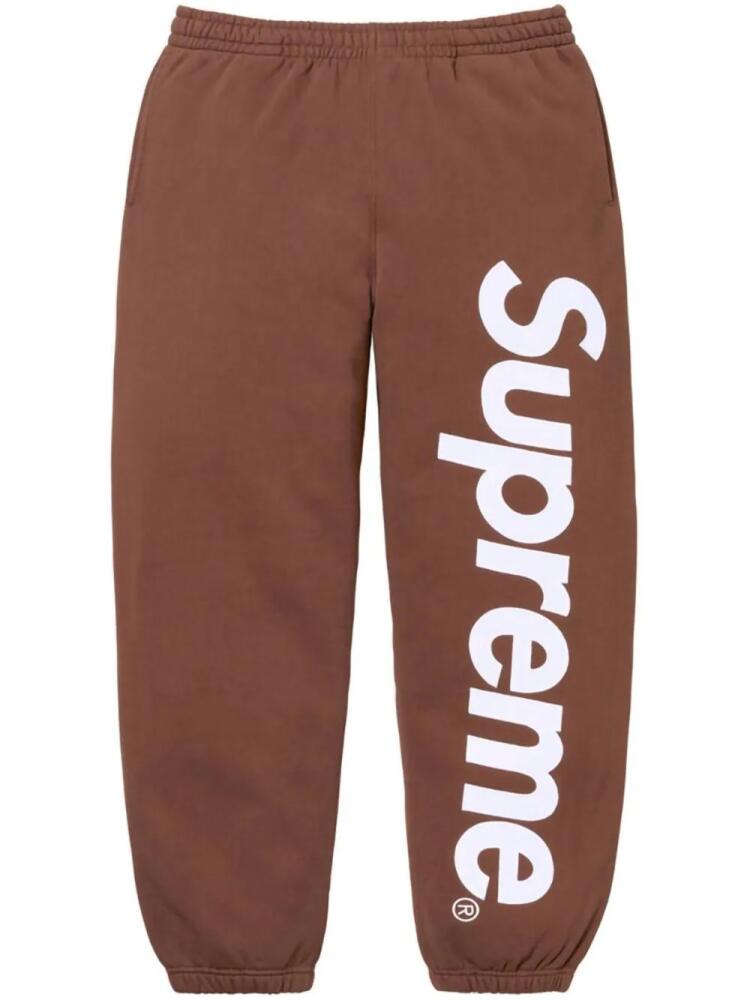 Supreme satin-appliqué cotton track pants - Brown Cover