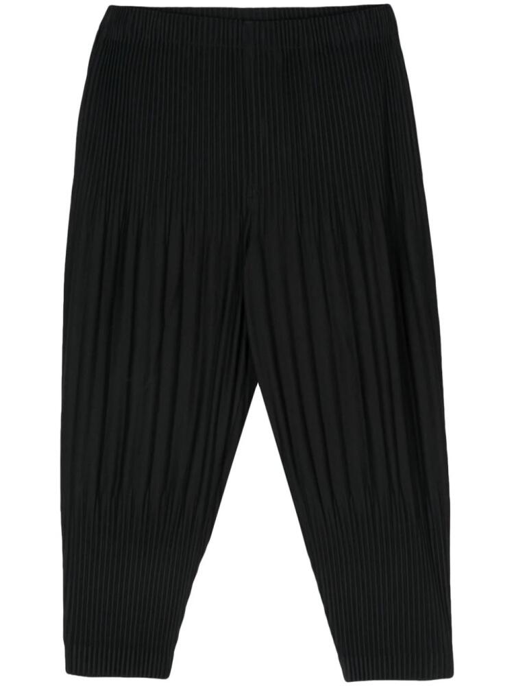 Homme Plissé Issey Miyake plissé tapered trousers - Black Cover