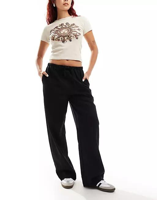 Weekday Mia linen mix pants in black Cover