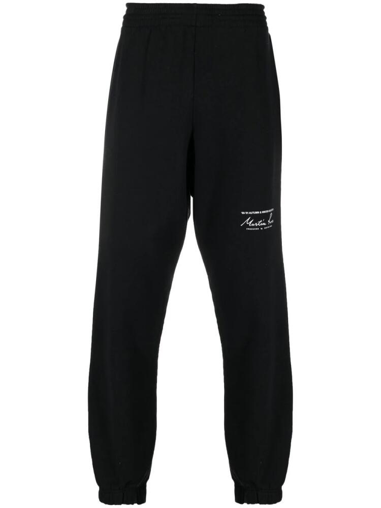 Martine Rose logo-print track pants - Black Cover