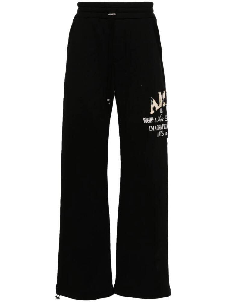 AMIRI logo-embroidered wide-leg track pants - Black Cover