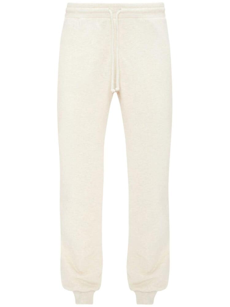 JW Anderson slogan-embroidered cotton track pants - White Cover