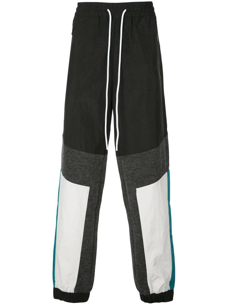 God's Masterful Children geometric panelled track pants - Black Cover