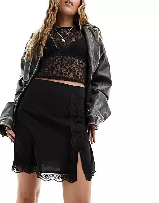 Monki lace trim mini skirt with thigh split in black Cover