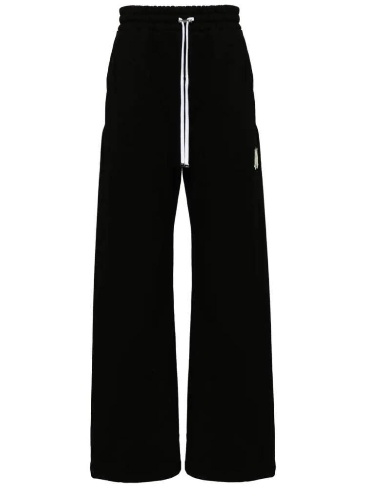 AMIRI logo-print cotton track pants - Black Cover