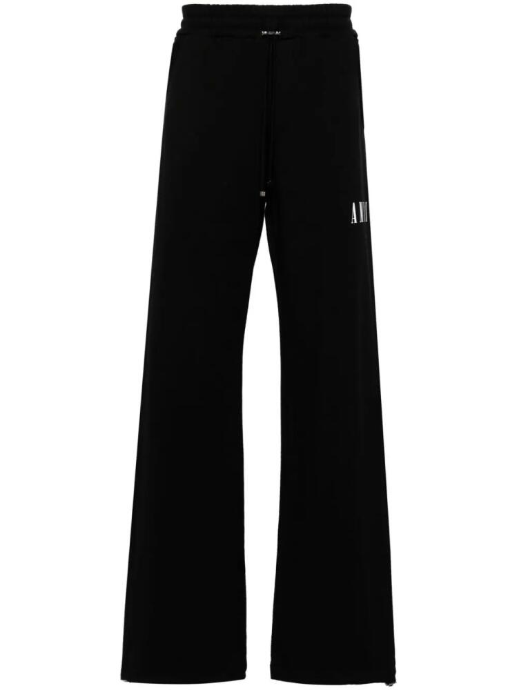 AMIRI Core logo-print wide-leg track pants - Black Cover