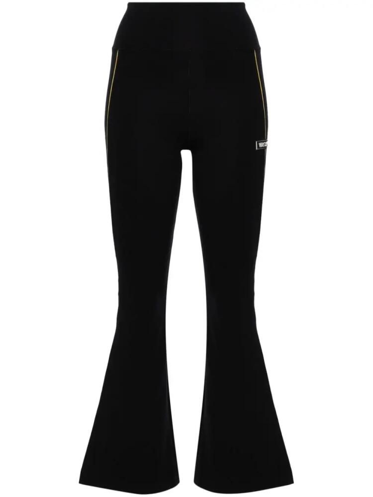 Versace logo-appliqué flared leggings - Black Cover