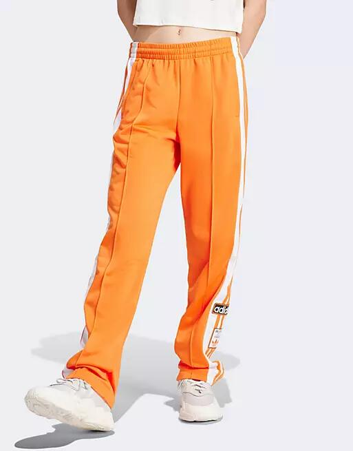 adidas Originals Adibreak track pants in orange Cover