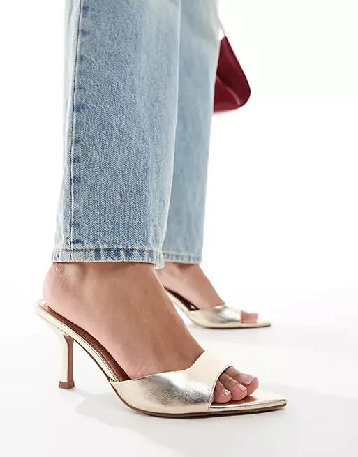 ASOS DESIGN Heyday pointed sole heeled mules in gold Cover